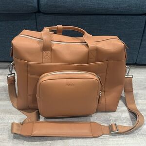 Monos Metro Duffel in Saddle Tan vegan leather.